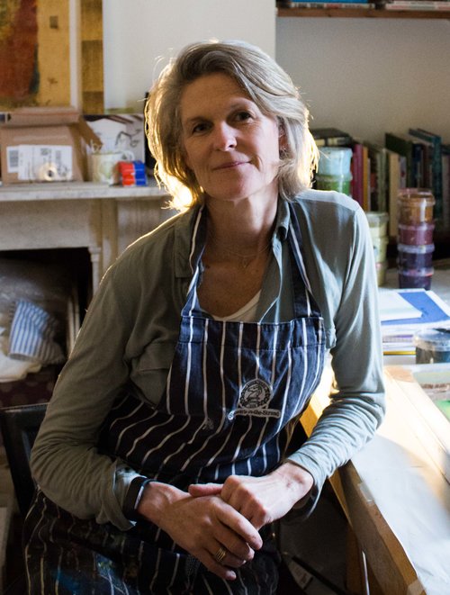 female artist in her art room